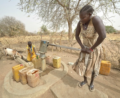 In Malek Miir, a village in South Sudan’s Lol State, where persistent drought has destroyed crops and left people hungry, a well provides much-needed water to a mother and her daughter. Persistent drought and other climate-linked disasters are growing more regular and severe. Credit: Paul Jeffrey/ACT